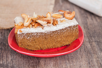Coffee cake with cashew nut on wood table