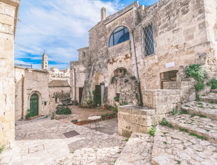 Fototapeta premium typical old street and stairs view of Matera under blue sky