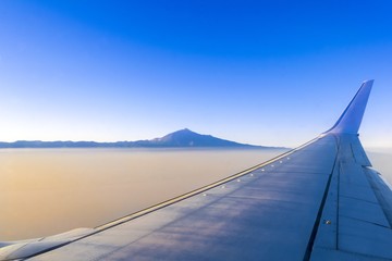 Flying on Tenerife and volcanic mountain Teide in the Teide National Park, Canary islands, Spain. - obrazy, fototapety, plakaty