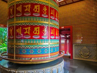 Zelfklevend Fotobehang Interior of the Buddhist temple, The Vairocana Buddha Prayer Wheel © Arndale