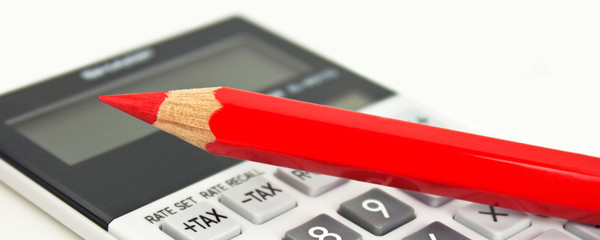 Red pencil and calculator