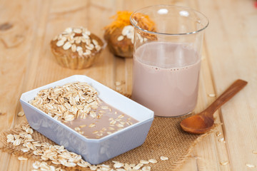 oat flakes mix with chocolate milk in blow