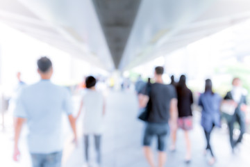 Abstract background of people on footbridge 