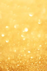 ..Gold christmas lights background with sparkling bokeh. Abstrac