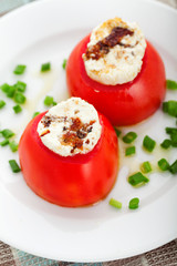 Stuffed tomatoes with goat cheese. Vertical shot