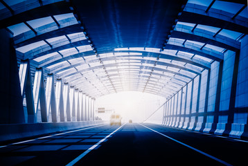 Traffic in a tunnel in blue tone.