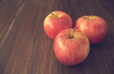 Apples on wooden rustic background