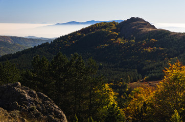 Autumn fog is rolling between hills of Zeljin mountain, Serbia