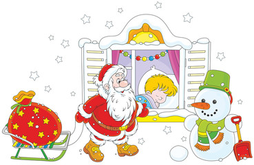 The night before Christmas, Santa Claus bringing his holiday presents for a little boy sleeping in his bedroom