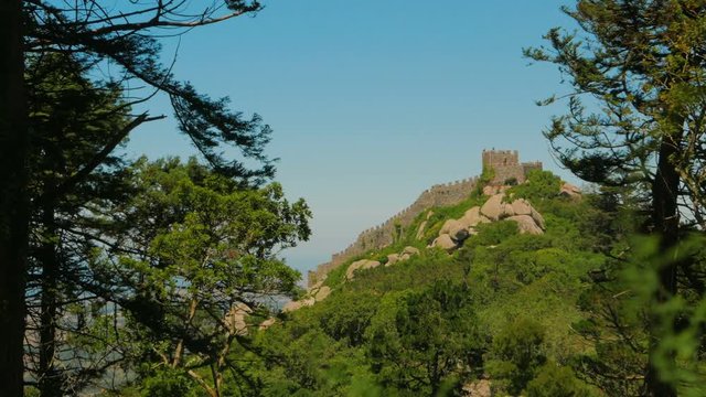 Establishing shot featuring the Castle of the Moors (Castelo dos Mouros), an Arabic castle dating from 8th century BC, located in Sintra, Portugal. 