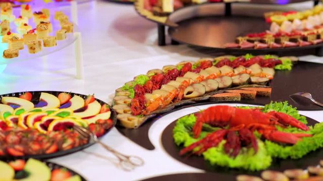 buffet: salads, meat and fish dishes are on the table