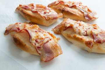  bacon and mozzarella  cheese on bread