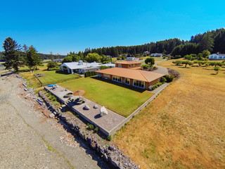 Aerial view of waterfront house with perfect landscape.