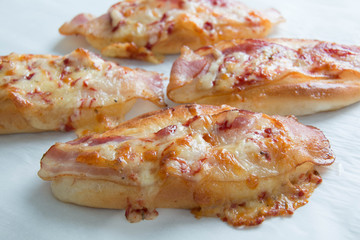  bacon and mozzarella  cheese on bread