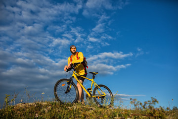 Fototapeta na wymiar Cyclist Riding the Bike on the Trail