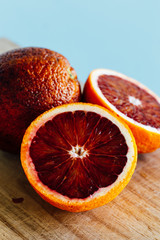 Blood oranges cut open on cutting board