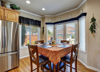 Nice dining room interior with brown table cloth