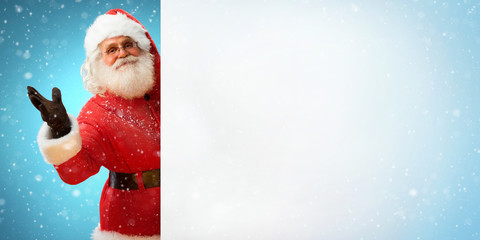 Smiling Santa Claus holding banner with  blank space for Your Text. Merry Christmas & New Year's...