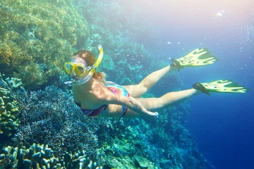 Fotobehang Duiken woman at snorkeling in the tropical water