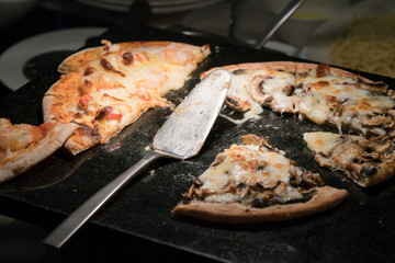 Hot pizza slice with melting cheese
