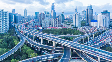 High-angle view of Shanghai Highway with skyscrapers in background.