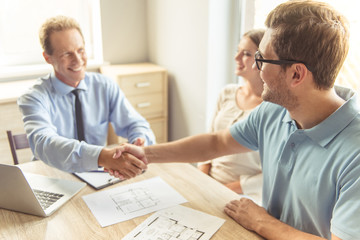 Couple visiting realtor