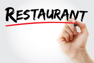 Hand writing RESTAURANT with marker, concept background