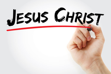 Hand writing Jesus Christ with marker, concept background