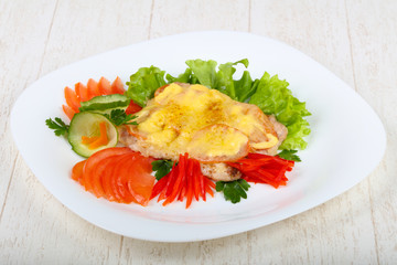 Pork steak with tomato and cheese