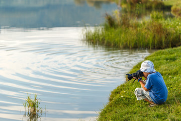 Little boy photographing