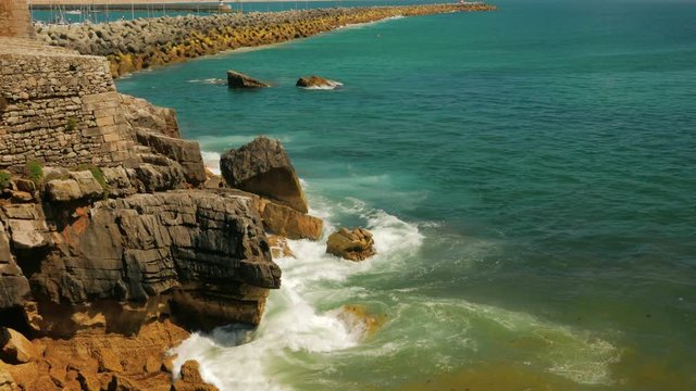 A panoramic shot showing the sea, jetty and coast of the fishing village of Peniche, Portugal
