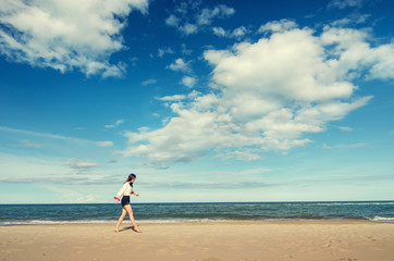 Fototapeta na wymiar Young asian woman relax on the beach, outdoor.