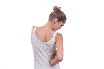 Young female touching right side of body in pain.  Kidney pain.
