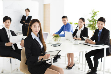 Group of happy young business people in  meeting