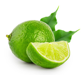 Obraz na płótnie Canvas Whole and slice of lime with leaves