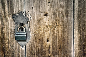 Wooden background with a lock