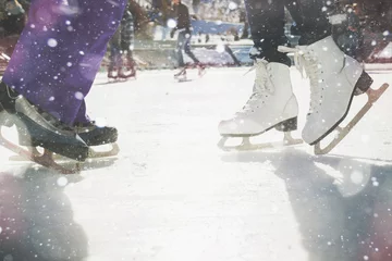 Fototapeten Closeup skating shoes ice skating outdoor at ice rink © petunyia