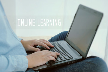 Man hand typing laptop and online learning word, e-learning