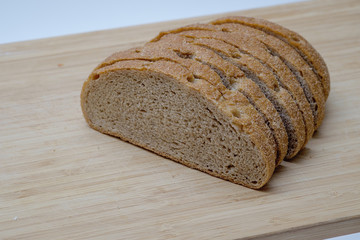 Sliced brown bread on wooden desk