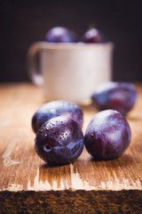 blue plums in cup