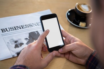 Hands of a man using mobile phone