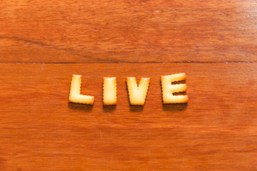 the word live written with cracker
