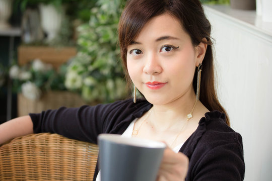 Portrait of thai adult women office beautiful girl drinking coffee