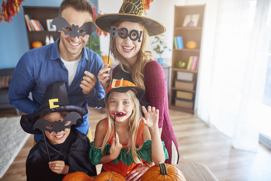 Family Wearing Funny Halloween Masks