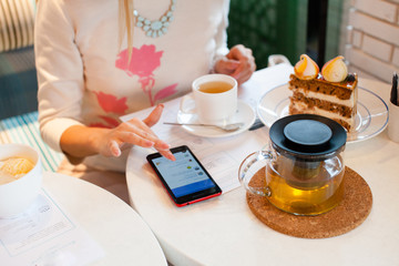 Young woman in city cafe.Drink  tea, wait for somebody. Waiting concept.