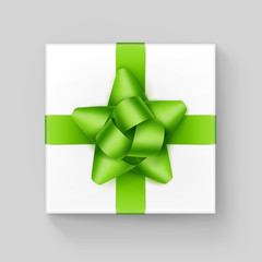 White Gift Box with Light Green Ribbon Bow on Background