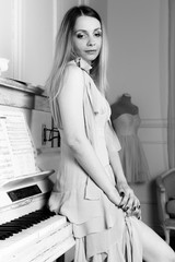 Portrait of a girl about the piano