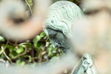 green bronze sculpture of Jesus
