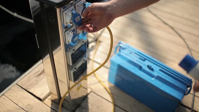 Repairer puts the toolbox to the ground