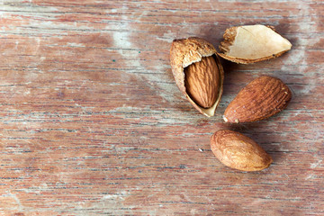 Roasted almonds on wood